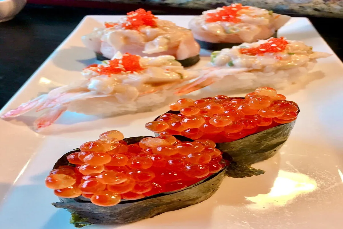 Chef preparing fresh sashimi platter